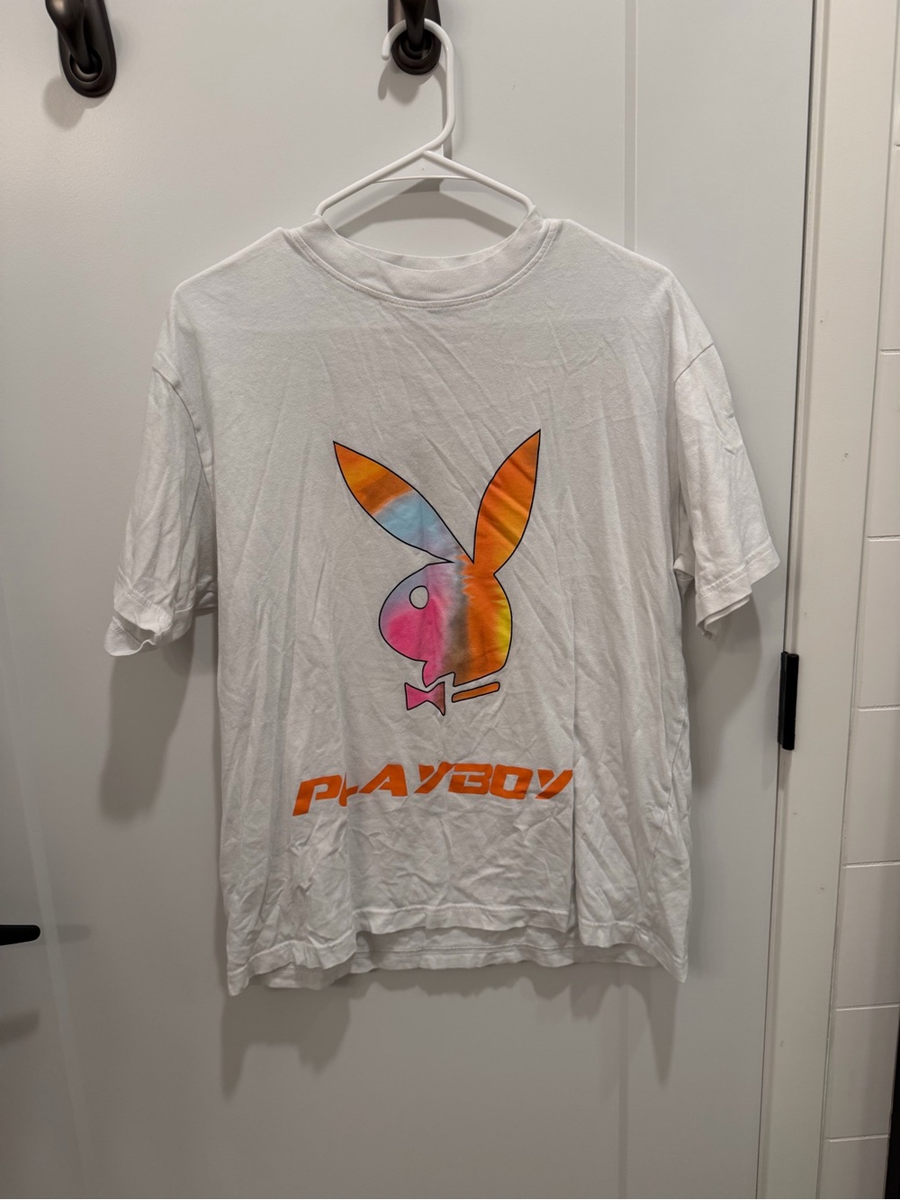 PLAYBOY White Tee with Rainbow Tie-Dye Bunny and Orange Logo